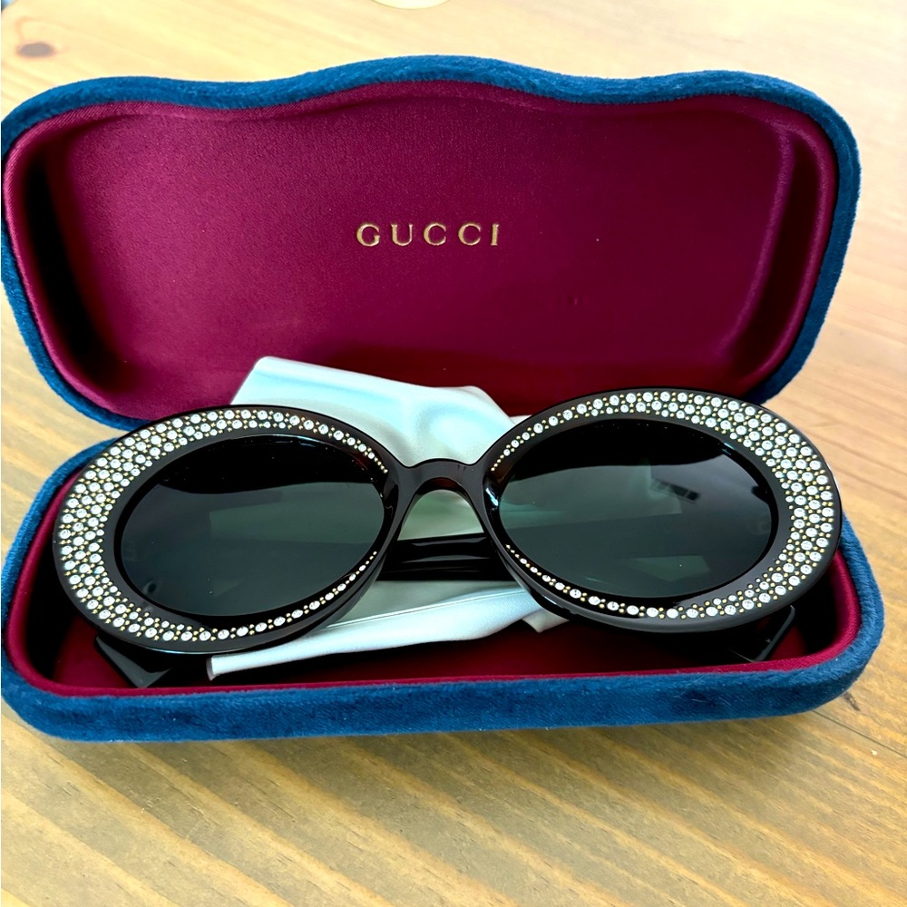 Brand new Gucci sunglasses with authenticity card.